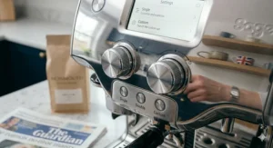 A detailed close-up of the polished chrome dials and tactile Single and Double buttons on a premium espresso machine.