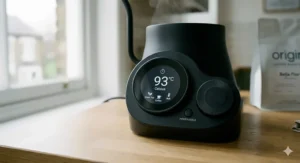 The digital base of an electric gooseneck kettle showing precise Celsius temperature settings for brewing.