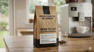 A photorealistic close-up of a stand-up coffee bag with a degassing valve, featuring a London Roasted label and a roast date stamp, sitting on a wooden kitchen worktop.