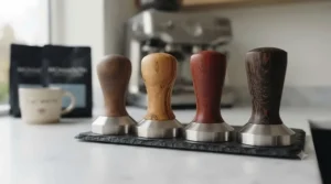 A collection of various wooden espresso tampers showcasing different timber styles.