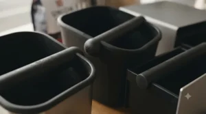 Close-up of a rubber-coated knock bar showing the shock-absorbent construction that protects your portafilter during use.
