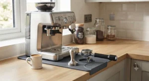 A complete barista station setup including the tamping mat, portafilter, and tamper for the Sage Barista Express.