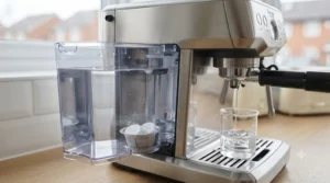 Clear water flowing from a properly maintained and cleaned home espresso machine